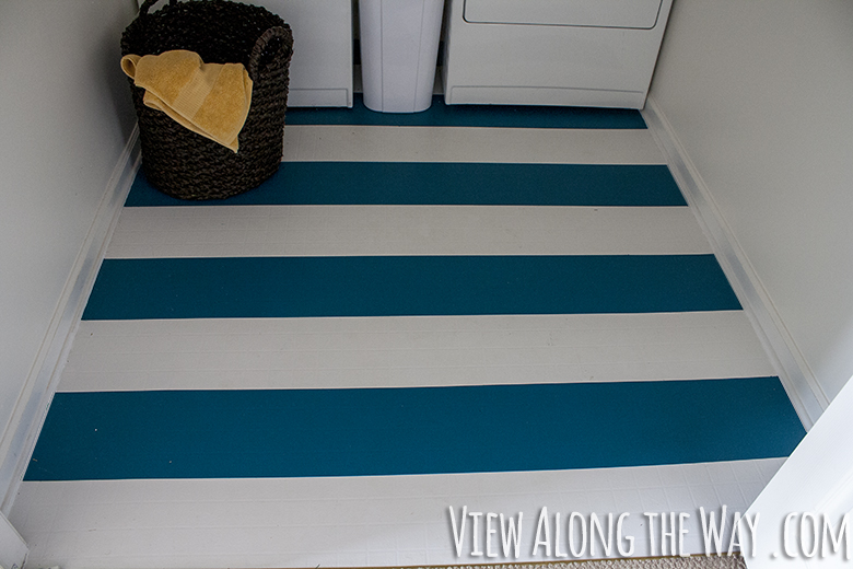 These floors are PAINTED! Come see how to make over your dated linoleum floors with a coat of paint!
