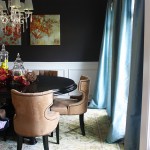 Dining room with dark walls, crown molding and chair rail at www.viewalongtheway.com