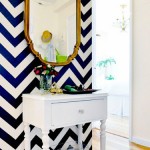 Wall stenciled with navy and white chevron stripes